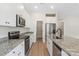 Bright kitchen featuring stainless steel appliances, granite counters, and ample cabinet space at 7319 Jerimoth Dr, Charlotte, NC 28215