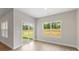 Bright, spacious living room with ample natural light and access to outdoor green space via sliding glass doors at 7319 Jerimoth Dr, Charlotte, NC 28215