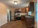 Updated kitchen with stainless steel appliances, and sleek brown cabinets at 1320 Kings Cir, Shelby, NC 28150