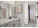 Bathroom with light gray cabinets, modern hardware, and a view into the shower/tub at 143 Goorawing Ln, Mooresville, NC 28115