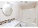 Compact bathroom featuring tub/shower combo, toilet, and vanity with round mirror at 238 Pointe Cir, Rock Hill, SC 29732