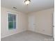 Modest bedroom featuring a window with blinds, carpeted floor and closet at 238 Pointe Cir, Rock Hill, SC 29732