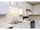 Bright kitchen featuring white countertops, white cabinetry, and modern appliances at 238 Pointe Cir, Rock Hill, SC 29732