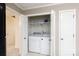 Convenient laundry area with modern appliances and built-in shelving for storage at 238 Pointe Cir, Rock Hill, SC 29732