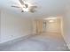 Open living room with neutral carpet, a ceiling fan, and ample natural light at 238 Pointe Cir, Rock Hill, SC 29732