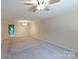 Spacious living room featuring neutral paint, carpet, and an open transition to the outdoor area at 238 Pointe Cir, Rock Hill, SC 29732