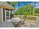 Relaxing back deck with hammock overlooking a private, wooded backyard at 4552 Sawgrass Ct, Denver, NC 28037
