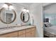 Bathroom featuring double sinks, granite countertops, and custom vanity at 4552 Sawgrass Ct, Denver, NC 28037