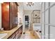 Elegant bathroom with double vanities, walk-in closet, and glass shower at 4552 Sawgrass Ct, Denver, NC 28037