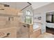 Luxury bathroom with large glass shower and soaking tub by the window at 4552 Sawgrass Ct, Denver, NC 28037