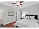 Bedroom featuring wood floors, white bedding, and a calming color scheme at 4552 Sawgrass Ct, Denver, NC 28037