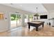 Game room with a pool table and a sliding glass door leading to the outside area at 4552 Sawgrass Ct, Denver, NC 28037