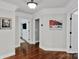 Hallway with hardwood floors, crown molding, and bright, neutral paint at 4552 Sawgrass Ct, Denver, NC 28037