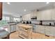 Bright kitchen with stainless steel appliances, white cabinets, and subway tile backsplash at 4552 Sawgrass Ct, Denver, NC 28037