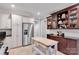 Bright kitchen with stainless steel refrigerator and breakfast bar at 4552 Sawgrass Ct, Denver, NC 28037