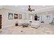 Spacious living room with neutral tones, lots of seating, and a unique coffee table at 4552 Sawgrass Ct, Denver, NC 28037