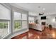 Inviting living room with hardwood floors, large windows, and fireplace at 4552 Sawgrass Ct, Denver, NC 28037