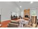 Bright living room with a stone fireplace, hardwood floors, and stylish furnishings at 4552 Sawgrass Ct, Denver, NC 28037