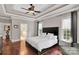 Spacious bedroom with hardwood floors, windows, and ensuite bathroom at 4552 Sawgrass Ct, Denver, NC 28037