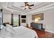 Cozy main bedroom with hardwood floor, fireplace, and sitting area at 4552 Sawgrass Ct, Denver, NC 28037