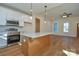 Kitchen with stainless appliances, white cabinets, an island, and is open to the living area at 1524 Conestoga Xing, Catawba, NC 28609