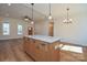 Kitchen island with white countertop is open to the living area, with lots of natural light at 1524 Conestoga Xing, Catawba, NC 28609