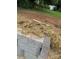 Close up of a retaining wall, straw, and fill dirt on a homesite at 1524 Conestoga Xing, Catawba, NC 28609