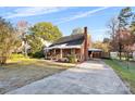 House's exterior showing front yard, driveway, and landscaping at 3726 The Plaza None, Charlotte, NC 28205