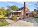 Brick house with a driveway and carport at 3726 The Plaza None, Charlotte, NC 28205