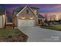 Lovely brick home with a two-car garage, complemented by a lush green lawn at 8159 Fairview Rd, Charlotte, NC 28226