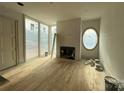 Living room featuring hardwood floors and a fireplace at 715 Charles Ave, Charlotte, NC 28205