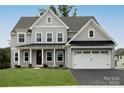 Charming two-story home with a two-car garage and well-manicured lawn at 843 Lake Forest Dr # Devonshire, Belmont, NC 28012