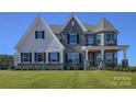 Beautiful two-story home with stone and shingle exterior at 843 Lake Forest Dr # Devonshire, Belmont, NC 28012