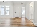 Bright entryway with hardwood floors and views into other rooms at 5217 Glenwalk Dr # 0059, Charlotte, NC 28269