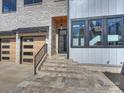 Close up of entryway with beautiful stone steps leading up to the front door at 914 Laurel Creek Ln, Charlotte, NC 28211
