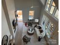 Bright open floor plan with cathedral ceiling, fireplace, light colored wood floors, and stylish decor at 4314 Morning Mist Dr # 15, Sherrills Ford, NC 28673