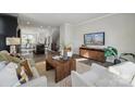 Open-concept living space with hardwood floors, modern decor, and plenty of natural light at 1015 Kokomo Ln # 22, Charlotte, NC 28206