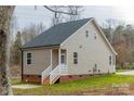 Tan vinyl sided home with a side entrance and steps at 317 Blackburn St # 4, York, SC 29745