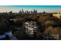 Aerial view of a building under construction, showcasing the city skyline in the background at 409 Queens Rd # 301, Charlotte, NC 28207