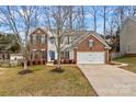 Two-story brick home with attached garage and landscaping at 286 Glencoe Ln, Mooresville, NC 28117