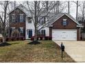 Two-story brick home with attached garage and landscaping at 286 Glencoe Ln, Mooresville, NC 28117