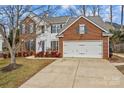 Two-story brick home with attached garage and landscaping at 286 Glencoe Ln, Mooresville, NC 28117