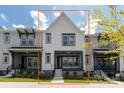 Modern townhome with a well-maintained front yard and neutral color scheme at 417 Prine Pl # Brx0013, Charlotte, NC 28213