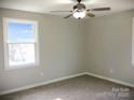 Bright bedroom with ceiling fan and neutral wall colors at 431 E 12Th Ave, Gastonia, NC 28054