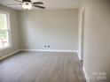 Spacious living room with neutral decor and hardwood floors at 431 E 12Th Ave, Gastonia, NC 28054