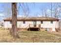 The back of the home has a deck and well kept yard, creating a private retreat at 1302 Hickory Nut Ln, Lincolnton, NC 28092
