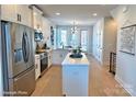 Modern kitchen with stainless steel appliances and a large island at 1013 North End Dr # 26, Charlotte, NC 28206