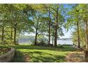 Picturesque backyard view with a lush green lawn at 501 Nivens Cove Rd, Mount Holly, NC 28120