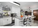 Kitchen features an island, stainless steel appliances, and white cabinets at 3220 Sawmill Rd, Hickory Grove, SC 29717