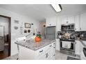 View of kitchen island, stainless steel appliances, and white cabinets at 3220 Sawmill Rd, Hickory Grove, SC 29717